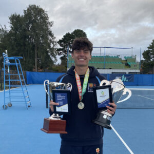 Daniel Jankoski, a Year 12 student at The McDonald College holding the tennis trophies - Pizzey Cup and Australia Cup